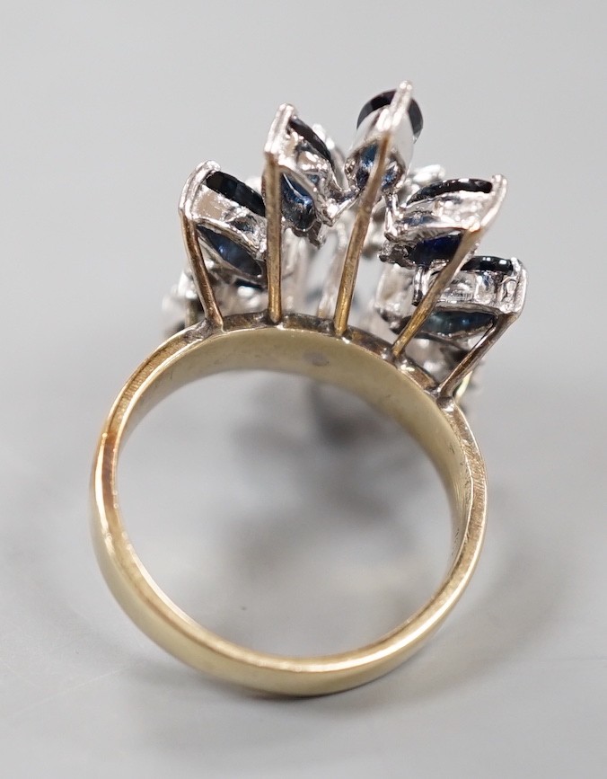 A modern 18k, sapphire and illusion set diamond chip set cluster dress ring, size K, gross weight 8.1 grams.